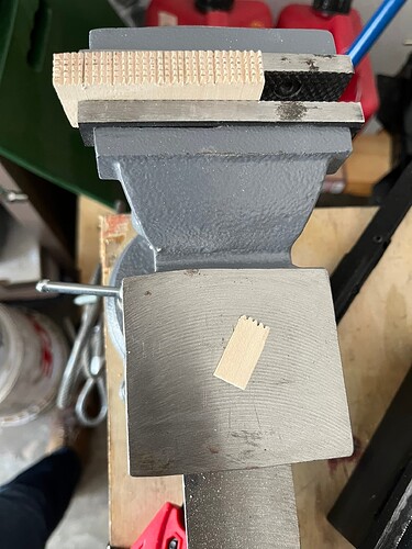 A Slat of Pegs Split Away